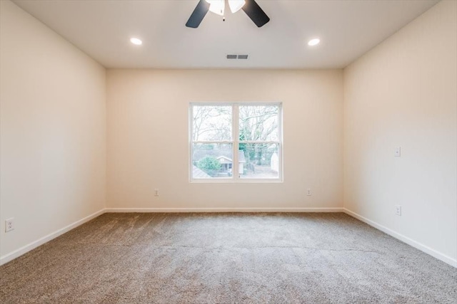 carpeted empty room with ceiling fan