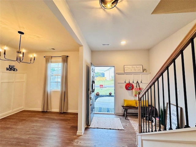 135 Softwood Ct, Dawsonville, GA 30534 - foyer entrance featuring a chandelier, wood finished floors, and stairs