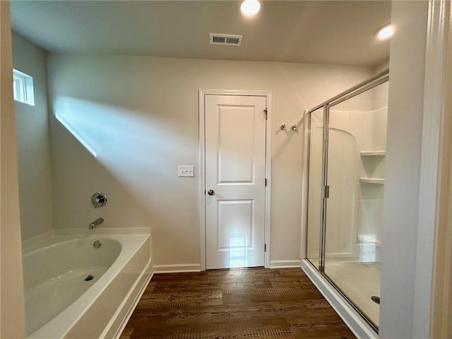 135 Softwood Ct, Dawsonville, GA 30534 - full bath featuring a bath, wood finished floors, and a shower stall