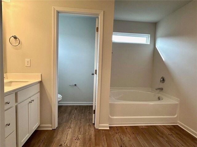 135 Softwood Ct, Dawsonville, GA 30534 - bathroom with a bath, wood finished floors, and vanity