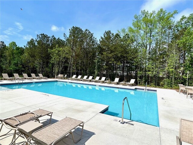 135 Softwood Ct, Dawsonville, GA 30534 - community pool with a patio