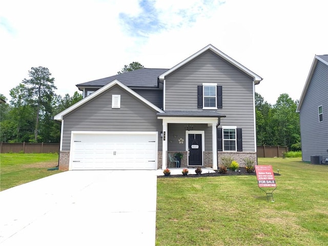 135 Softwood Ct, Dawsonville, GA 30534 - traditional-style house with concrete driveway, an attached garage, and stone siding