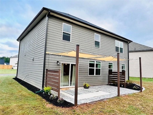 135 Softwood Ct, Dawsonville, GA 30534 - back of house with a patio and a lawn