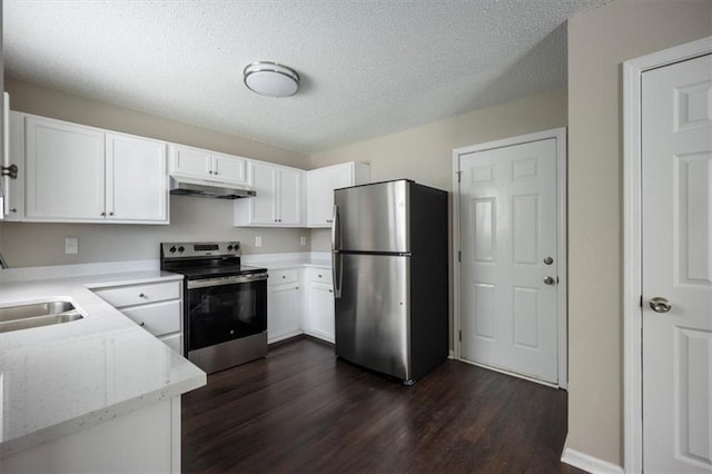 3915 Cypress Pointe Dr, Union City, GA 30291 - kitchen with stainless steel appliances, a sink, under cabinet range hood, dark wood finished floors, and white cabinets