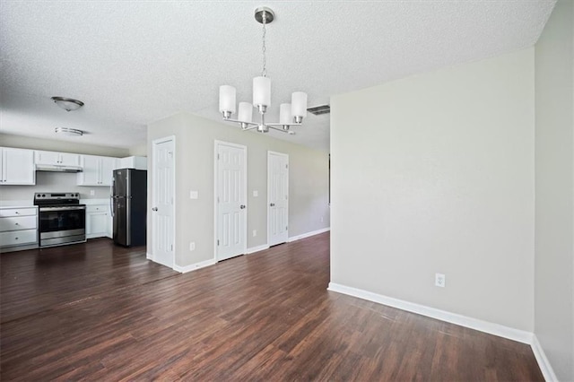 3915 Cypress Pointe Dr, Union City, GA 30291 - unfurnished living room with a chandelier, dark wood-style flooring, a textured ceiling, and baseboards