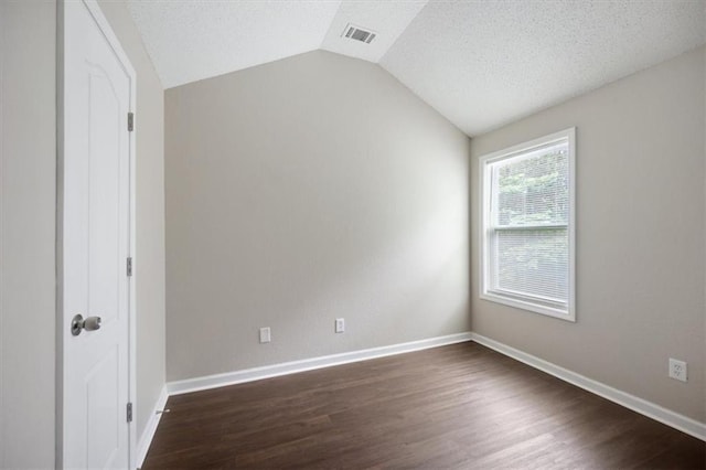 3915 Cypress Pointe Dr, Union City, GA 30291 - bonus room featuring vaulted ceiling, dark wood finished floors, baseboards, and a textured ceiling