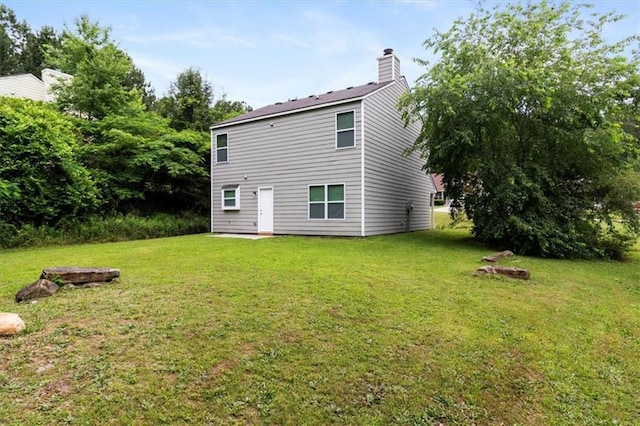 3915 Cypress Pointe Dr, Union City, GA 30291 - back of house with a yard and a chimney