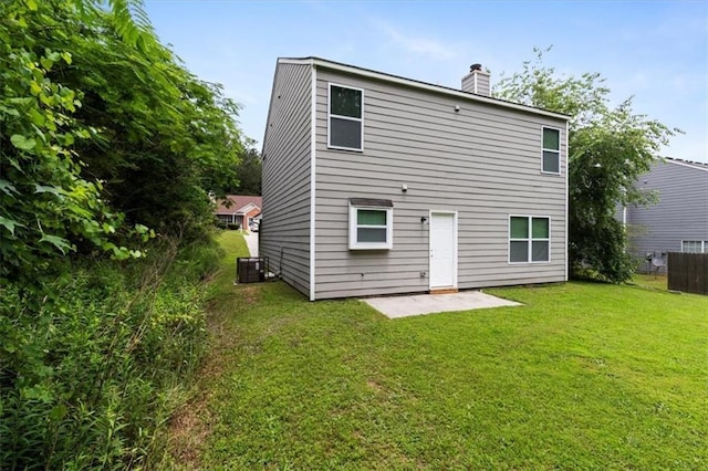 3915 Cypress Pointe Dr, Union City, GA 30291 - back of property featuring central AC, a patio area, and a chimney