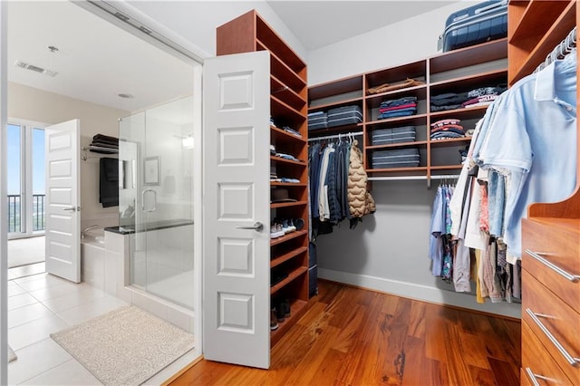 spacious closet with light wood-type flooring