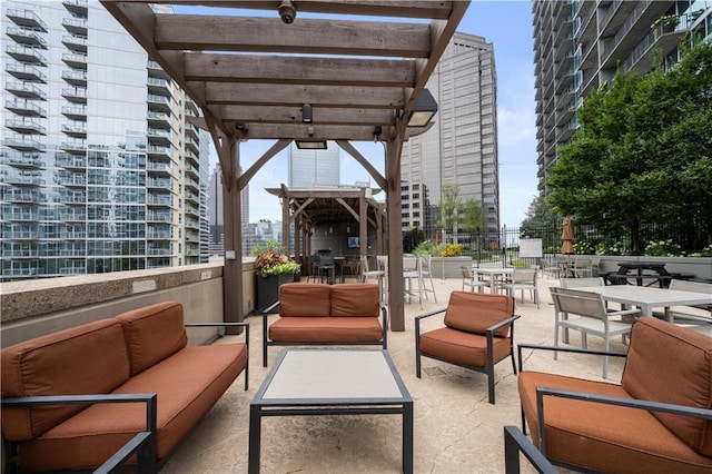 view of patio with an outdoor living space and a pergola