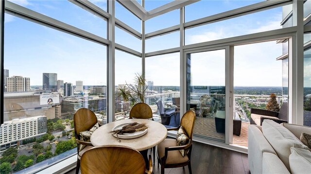 45 Ivan Allen Jr Blvd NW Unit 2705, Atlanta, GA 30308 - sunroom with wood finished floors, a wall of windows, and a city view