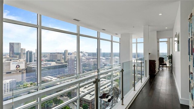 45 Ivan Allen Jr Blvd NW Unit 2705, Atlanta, GA 30308 - hall with a city view, floor to ceiling windows, and dark wood finished floors