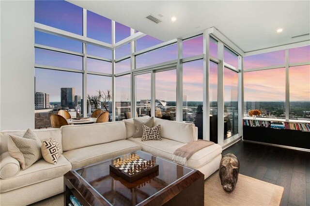 45 Ivan Allen Jr Blvd NW Unit 2705, Atlanta, GA 30308 - living room featuring wood-type flooring, a wall of windows, a city view, and recessed lighting