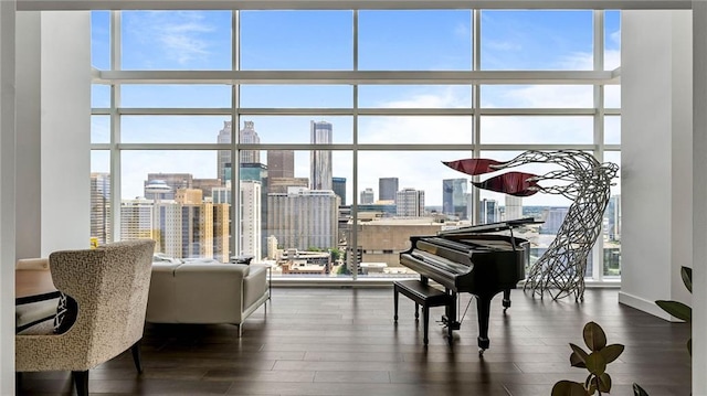 45 Ivan Allen Jr Blvd NW Unit 2705, Atlanta, GA 30308 - sitting room with expansive windows, a skyline view, healthy amount of natural light, and dark wood finished floors