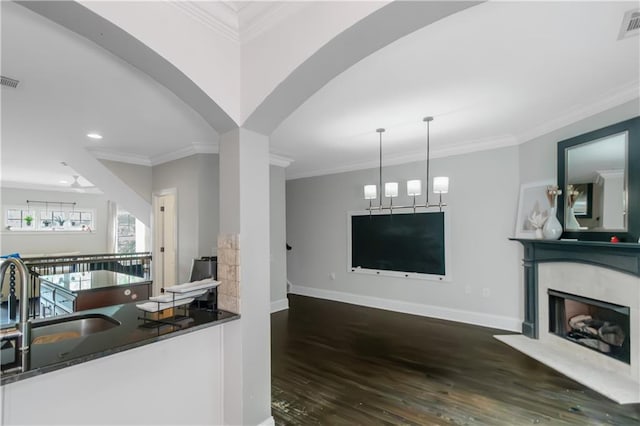 1786 Dekalb Ave NE, Atlanta, GA 30307 - kitchen featuring wood finished floors, a sink, open floor plan, baseboards, and dark countertops