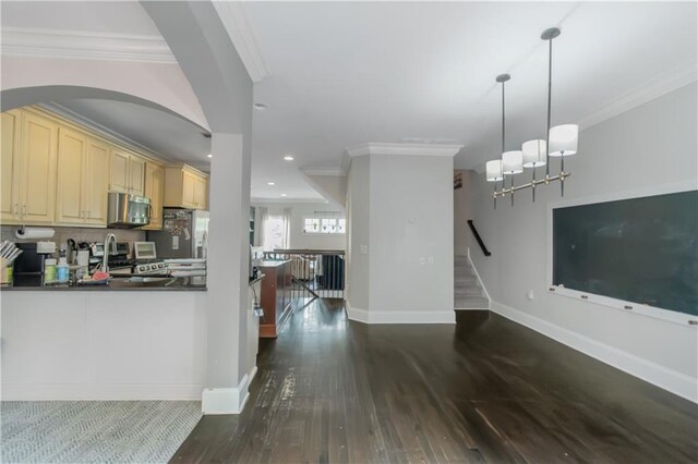1786 Dekalb Ave NE, Atlanta, GA 30307 - kitchen with appliances with stainless steel finishes, crown molding, dark countertops, dark wood-style floors, and baseboards