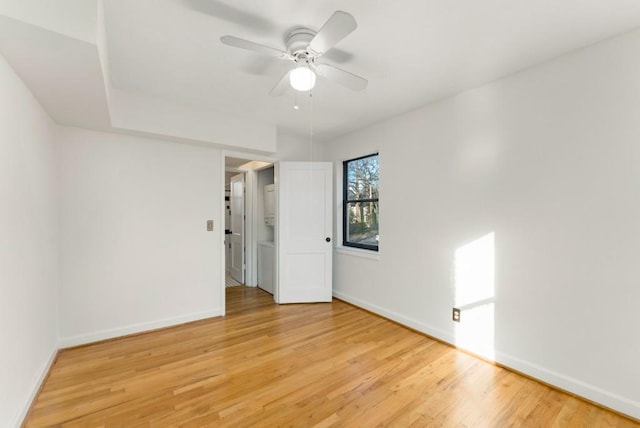 spare room with ceiling fan and light hardwood / wood-style flooring