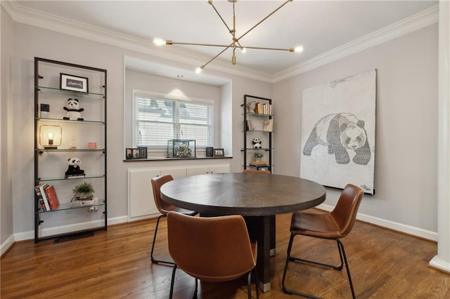 dining space featuring crown molding, dark hardwood / wood-style flooring, and a notable chandelier