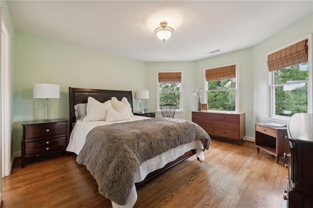 bedroom with hardwood / wood-style floors