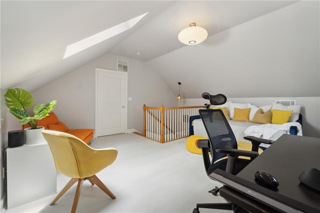 office space with light colored carpet and vaulted ceiling with skylight