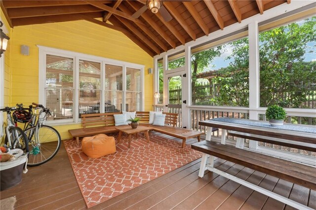 sunroom with vaulted ceiling with beams and plenty of natural light