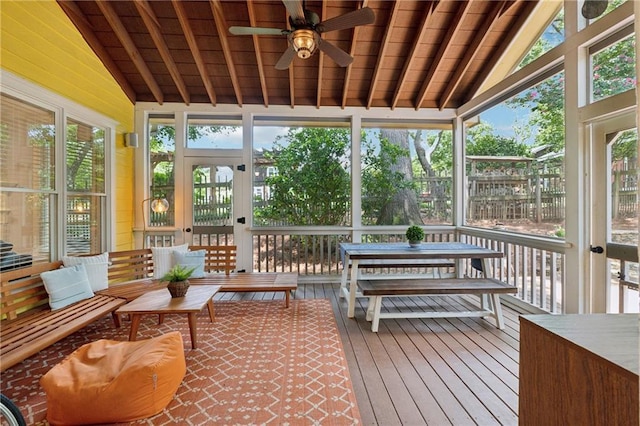 sunroom with ceiling fan, wood ceiling, and vaulted ceiling