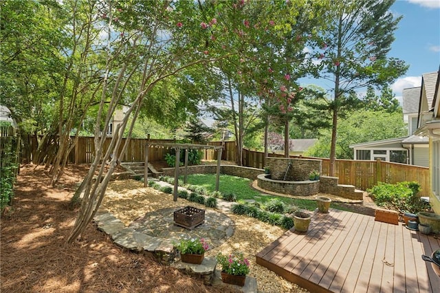 view of yard featuring a fire pit and a deck