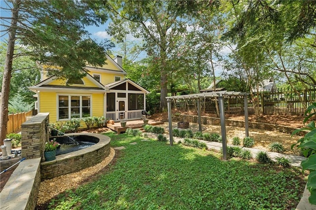 view of yard featuring a deck and a sunroom