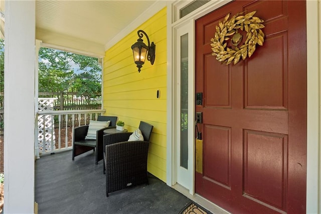 doorway to property with a porch