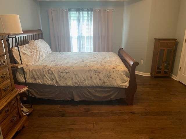 2253 Dillard Xing, Tucker, GA 30084 - bedroom with baseboards and wood finished floors