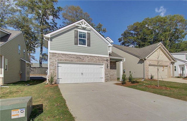 view of front of property with a front lawn and a garage