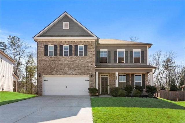 view of front of home featuring a garage and a front lawn