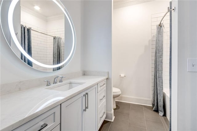 625 Piedmont Ave NE Unit 2004, Atlanta, GA 30308 - bathroom with ornamental molding, vanity, toilet, tile patterned floors, and baseboards