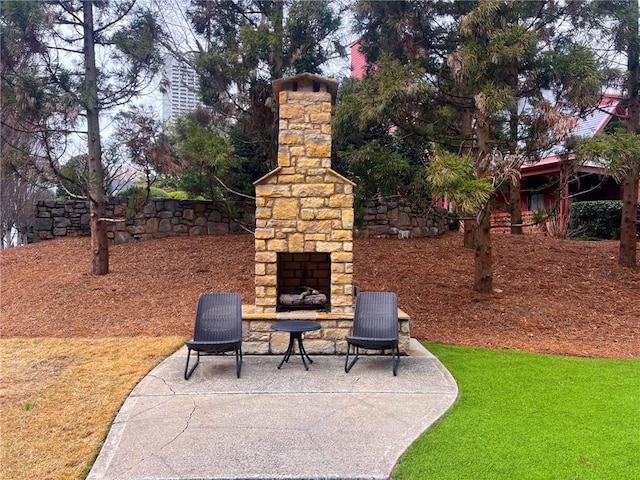 625 Piedmont Ave NE Unit 2004, Atlanta, GA 30308 - view of patio / terrace featuring an outdoor stone fireplace