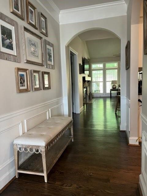 corridor with ornamental molding and dark hardwood / wood-style floors