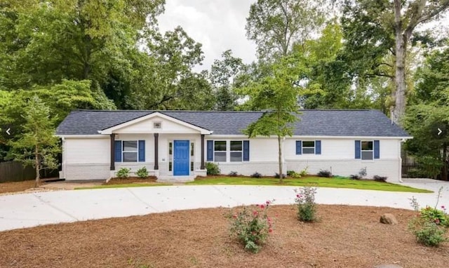 single story home with brick siding and roof with shingles