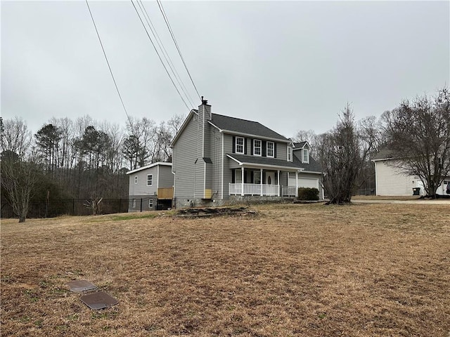 exterior space featuring a lawn and a porch