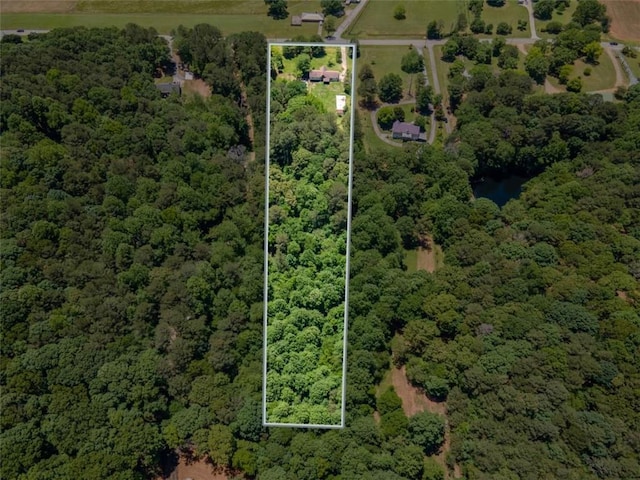 3769 Bay Creek Church Rd, Loganville, GA 30052 - aerial overview of property's location featuring a forest and property parcel outlined
