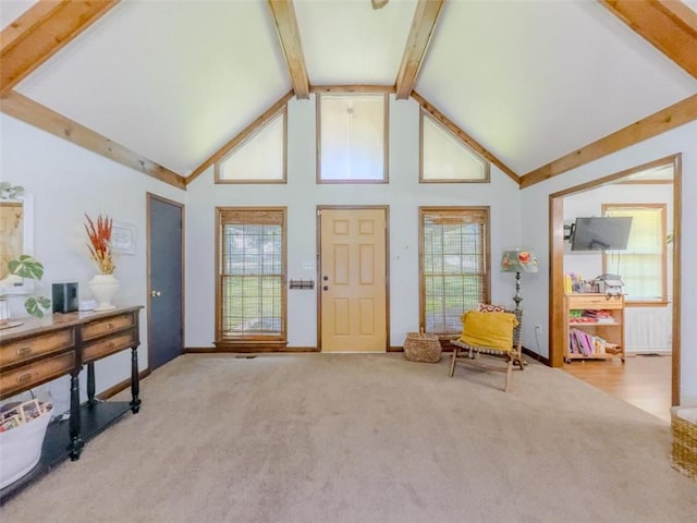 3769 Bay Creek Church Rd, Loganville, GA 30052 - foyer entrance featuring high vaulted ceiling, carpet floors, baseboards, and beam ceiling