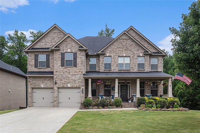 4435 Mossbrook Cir, Alpharetta, GA 30004 - craftsman inspired home featuring an attached garage, driveway, a porch, and brick siding
