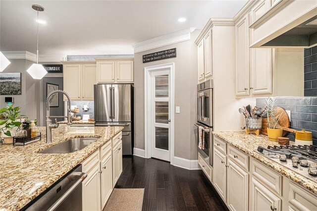 4435 Mossbrook Cir, Alpharetta, GA 30004 - kitchen featuring appliances with stainless steel finishes, cream cabinets, premium range hood, a sink, and baseboards