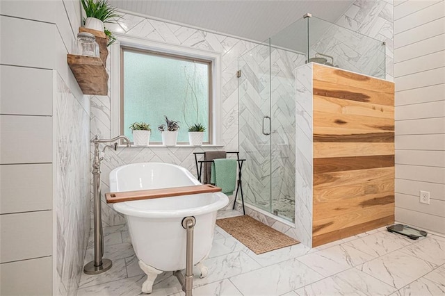 4435 Mossbrook Cir, Alpharetta, GA 30004 - bathroom featuring marble look tile flooring, a freestanding bath, a stall shower, tile walls, and wooden walls