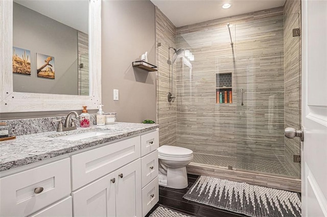 4435 Mossbrook Cir, Alpharetta, GA 30004 - bathroom featuring vanity, toilet, a stall shower, and recessed lighting