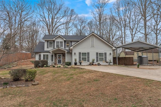 traditional-style home featuring fence, a carport, stone siding, driveway, and a front lawn