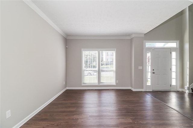 foyer entrance with baseboards, ornamental molding, and dark wood finished floors