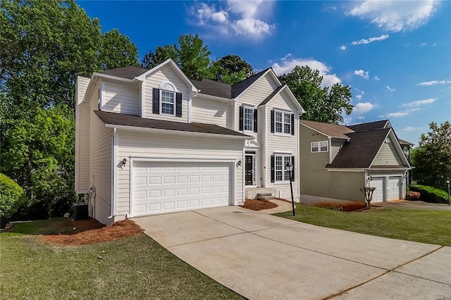 view of front of property featuring a front lawn and concrete driveway