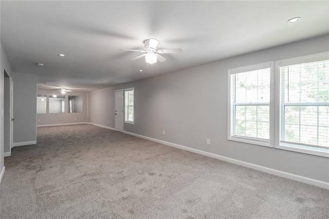carpeted empty room featuring baseboards, recessed lighting, and ceiling fan