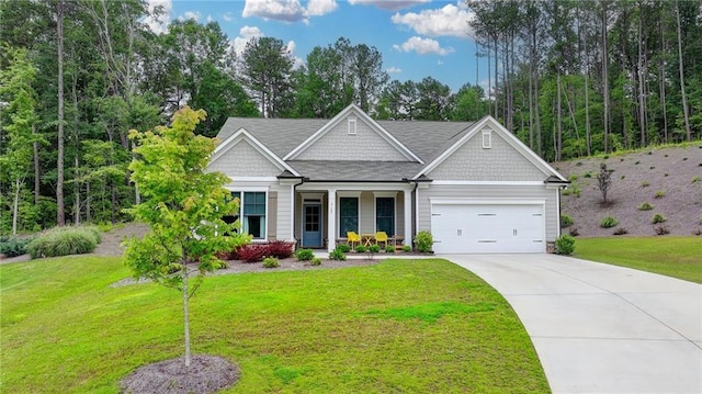 2129 Charmond Dr, Monroe, GA 30656 - craftsman inspired home featuring an attached garage, a porch, a front lawn, and driveway