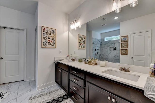2129 Charmond Dr, Monroe, GA 30656 - bathroom featuring double vanity, tiled shower, and marble look tiles