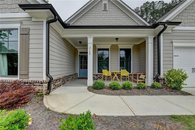 2129 Charmond Dr, Monroe, GA 30656 - doorway to property featuring covered porch and an attached garage